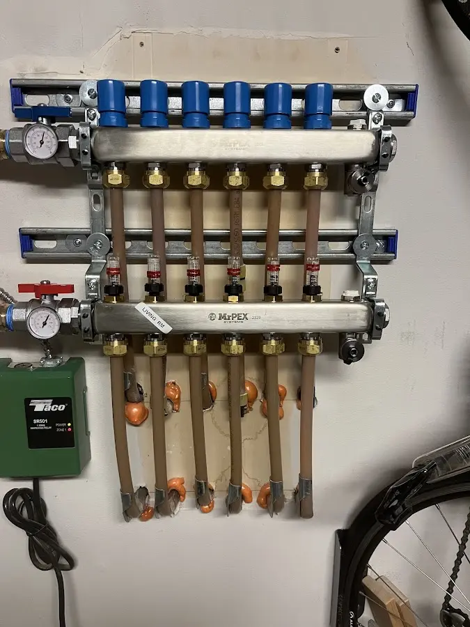 Plumber performing Water Heater Repair at a residential property in Portsmouth